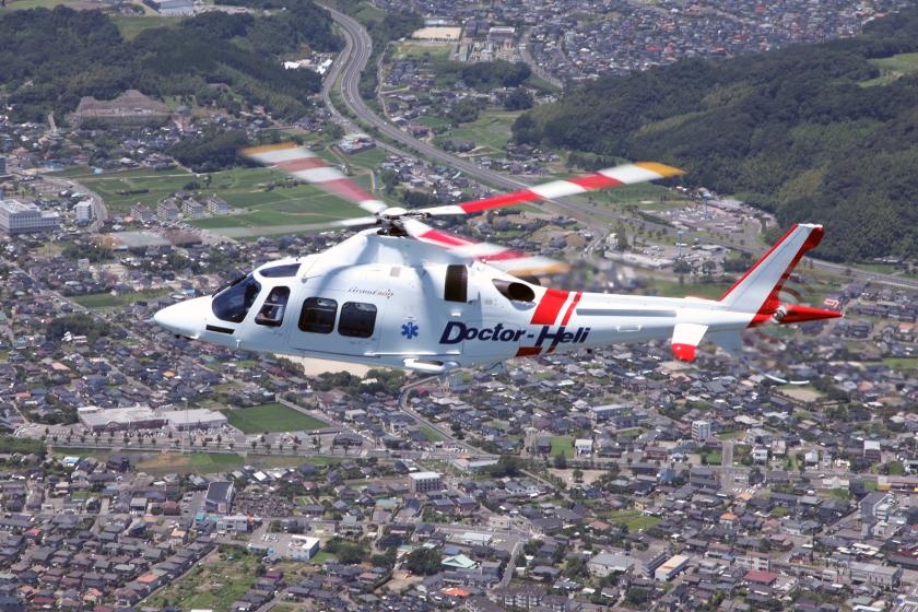 Leonardo AW109 GrandNew в медицинской окраске над городом
